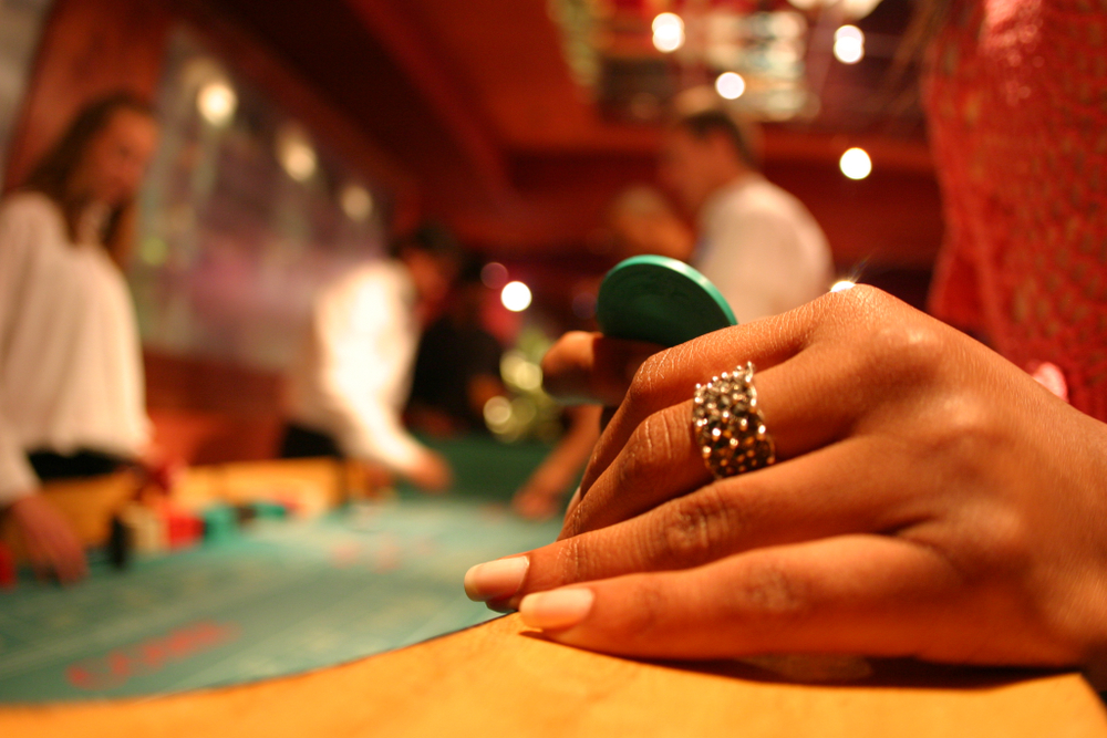 woman-hand-holding-casino-fish